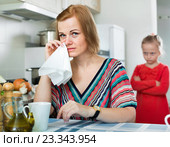Upset girl and mother have a peeve on each other. Стоковое фото, фотограф Яков Филимонов / Фотобанк Лори