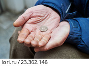hands of beggar with us cent coin begging for money. Стоковое фото, фотограф Дмитрий Калиновский / Фотобанк Лори