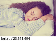 Curly haired girl having a nap in bed. Стоковое фото, фотограф Яков Филимонов / Фотобанк Лори