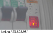 Woman finger turns on electricity switch and button is lighting. Стоковое видео, видеограф Данил Руденко / Фотобанк Лори