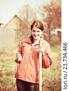 woman resetting raspberry sprouts. Стоковое фото, фотограф Яков Филимонов / Фотобанк Лори