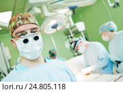 male cardiac surgeon at child cardiosurgery operating room. Стоковое фото, фотограф Дмитрий Калиновский / Фотобанк Лори