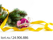 Artificial fir-tree branch with a ball, a background for New year and Christmas on a white background. Стоковое фото, фотограф Artem Sobov / Фотобанк Лори