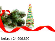 Artificial fir-tree branch with a ball, a background for New year and Christmas on a white background. Стоковое фото, фотограф Artem Sobov / Фотобанк Лори
