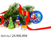 Toy snowman under a branch of an artificial Christmas tree with the cone and a red tape. Стоковое фото, фотограф Artem Sobov / Фотобанк Лори