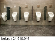 Many urinals in a toilet. Стоковое фото, фотограф Николай Голицынский / Фотобанк Лори