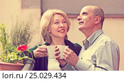 Couple drinking tea at balcony. Стоковое фото, фотограф Яков Филимонов / Фотобанк Лори