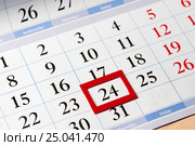 Date highlighted in red on calendar with black numbers. Стоковое фото, фотограф Сергей Федулов / Фотобанк Лори