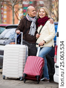 Senior charming couple of travellers posing with trollers. Стоковое фото, фотограф Яков Филимонов / Фотобанк Лори