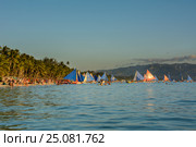 Boracay, Philippines - March 16, 2016: Colorful sailboats on the shore of the island Boracay. Редакционное фото, фотограф Ершов Максим / Фотобанк Лори