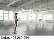 Handsome busy businessman making notes . Mixed media. Стоковое фото, фотограф Sergey Nivens / Фотобанк Лори