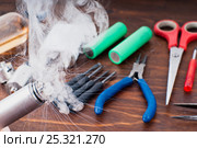 Check RDA. Set to vape. Tools, cotton, liquid, RDA, RTA. Стоковое фото, фотограф Сергей Лабутин / Фотобанк Лори