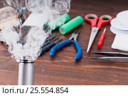 Check RDA. Set to vape. Tools, cotton, liquid, RDA, RTA. Стоковое фото, фотограф Сергей Лабутин / Фотобанк Лори