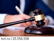 Handsome judge with gavel sitting in courtroom. Стоковое фото, фотограф Elnur / Фотобанк Лори