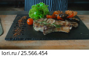 Beef Steak With Grilled Vegetables On Wooden Board. Стоковое видео, видеограф Станислав Панкратов / Фотобанк Лори