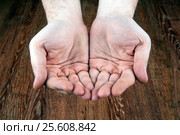 Male hands on a wooden background. Стоковое фото, фотограф Александр Калугин / Фотобанк Лори