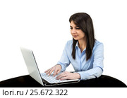 Young girl sitting in the office in front of computer, she is typing on a keyboard. White isolated background. Стоковое фото, фотограф Светлана Васильева / Фотобанк Лори
