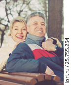 Smiling mature couple relaxing in park. Стоковое фото, фотограф Яков Филимонов / Фотобанк Лори