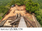 A view down the stairs of Sigiriya Rock or Lion Rock, a World Heritage Site near Dambulla, Sri Lanka. Стоковое фото, агентство BE&W Photo / Фотобанк Лори