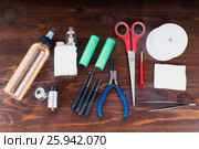 Set to vape. Tools, cotton, liquid, RDA, RTA. Стоковое фото, фотограф Сергей Лабутин / Фотобанк Лори