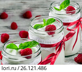 Tasty yogurt with raspberries and mint in a glass jars, selectiv. Стоковое фото, фотограф Oksana Zh / Фотобанк Лори
