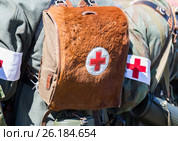 Unidentified re-enactors dressed as German military paramedic with a red cross brassard and medical bag. Стоковое фото, фотограф FotograFF / Фотобанк Лори