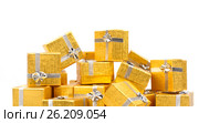 Close up of a pile of gold gifts on white. Стоковое фото, фотограф Tatjana Romanova / Фотобанк Лори