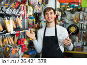 Professional young pleasant salesman working and smiling. Стоковое фото, фотограф Яков Филимонов / Фотобанк Лори