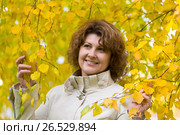 Woman with curly hair near autumn birch. Стоковое фото, фотограф Володина Ольга / Фотобанк Лори
