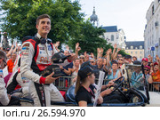 LE MANS, FRANCE - JUNE 16, 2017: Thomas Laurent french pilot with team of Jackie Chan DC racing Oreca 07-Gibson. Winner of races 24 hours Le Mans LMP2 2017.Parade of pilots racing at Le mans, France. Редакционное фото, фотограф Irina Kuchugurina/Gaudy / Фотобанк Лори