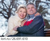 Smiling mature couple relaxing in park. Стоковое фото, фотограф Яков Филимонов / Фотобанк Лори