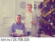 Mature married couple discuss contract and sign important documents. Стоковое фото, фотограф Яков Филимонов / Фотобанк Лори