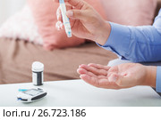 medicine, diabetes, glycemia, health care and people concept - close up of male finger with test stripe. Стоковое фото, фотограф Майя Крученкова / Фотобанк Лори