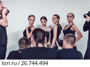 Photographers paparazzi take photos of women in cocktail dresses. Стоковое фото, фотограф Женя Канашкин / Фотобанк Лори