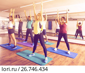 Adults having group fitness class. Стоковое фото, фотограф Яков Филимонов / Фотобанк Лори