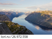 Preikestolen or Prekestolen or Preacher's Pulpit or Pulpit Rock, is a famous tourist attraction in Forsand, Ryfylke, Norway (2017 год). Стоковое фото, фотограф Алексей Ширманов / Фотобанк Лори