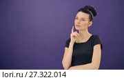 Pensive woman at lilac background. Стоковое видео, видеограф Илья Шаматура / Фотобанк Лори