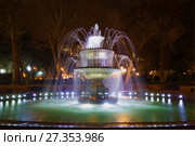 BAKU, AZERBAIJAN - DECEMBER 29, 2017: Fountain in the Vahid Park in the night illumination. Редакционное фото, фотограф Виктор Карасев / Фотобанк Лори
