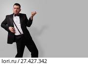 man in tuxedo playing rock-n-roll. Стоковое фото, фотограф Александр Лычагин / Фотобанк Лори
