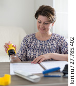 Woman accountant puts seal on documents. Стоковое фото, фотограф Володина Ольга / Фотобанк Лори
