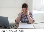 Tired of work woman holding her head. Стоковое фото, фотограф Володина Ольга / Фотобанк Лори