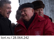 Павел Грудинин, кандидат в президенты РФ от КПРФ, и Геннадий Зюганов, председатель Центрального комитета КПРФ, стоят на сцене во время митинга КПРФ на площади Революции в центре города Москвы, Россия 23 февраля 2018. Редакционное фото, фотограф Николай Винокуров / Фотобанк Лори