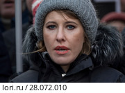 Кандидат на пост президента РФ от партии "Гражданская инициатива", телеведущая Ксения Собчак во время марша памяти политика Бориса Немцова на Страстном бульваре города Москвы, Россия, 25 февраля 2018. Редакционное фото, фотограф Николай Винокуров / Фотобанк Лори