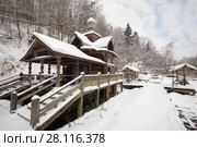Wooden old-style structure with baptistery in Russian Orthodox Monastery at winter day. Стоковое фото, фотограф Losevsky Pavel / Фотобанк Лори