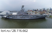 NEW-YORK - SEP 07, 2014: Ship USS Intrepid (CV-11) with Sea-Air-Space museum on pier 86 near city at autumn day. Aerial view. Ship was decommissioned in 1974. Редакционное фото, фотограф Losevsky Pavel / Фотобанк Лори