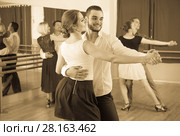 men and women enjoying of tango in class. Стоковое фото, фотограф Яков Филимонов / Фотобанк Лори