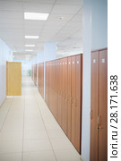 Long hallway with many wooden cabinets and opened door in office. Стоковое фото, фотограф Losevsky Pavel / Фотобанк Лори