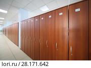 Long hallway with many wooden cabinets in big office of company. Стоковое фото, фотограф Losevsky Pavel / Фотобанк Лори
