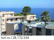 Sea view apartment house on Mediterranean coast, flat roofs and green bush on them (2016 год). Стоковое фото, фотограф Losevsky Pavel / Фотобанк Лори