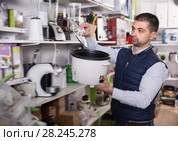 Glad man is looking on multivariates. Стоковое фото, фотограф Яков Филимонов / Фотобанк Лори